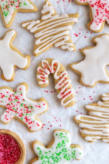 frosted almond flour sugar cookies with sugar on top.