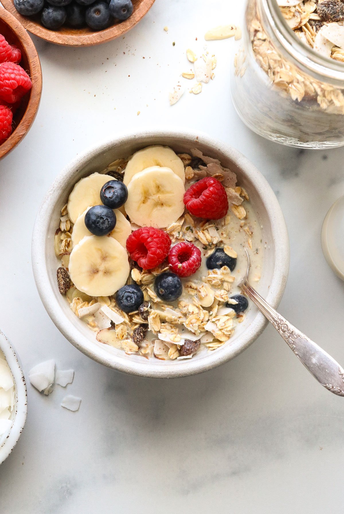 muesli served with banana slices and berries.