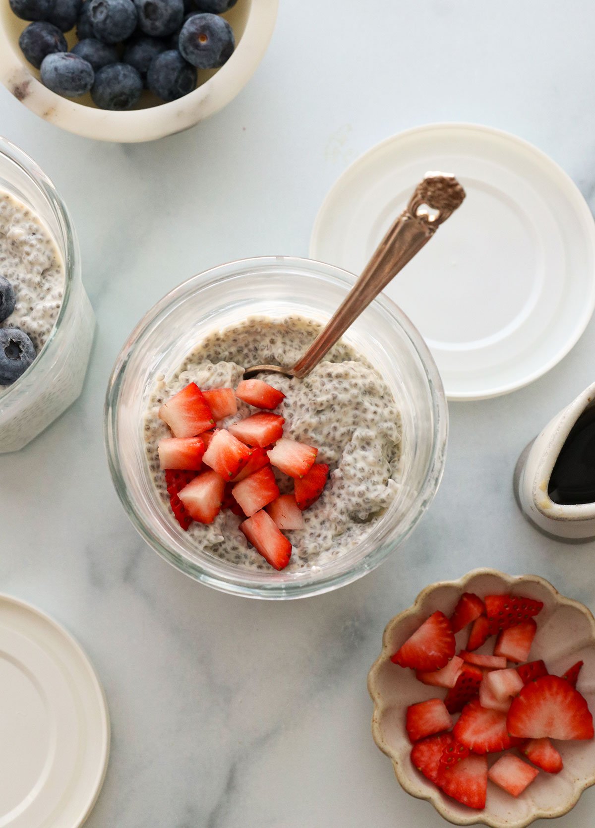 protein chia pudding topped with chopped strawberries.