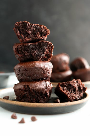 date brownies stacked on dark plate.