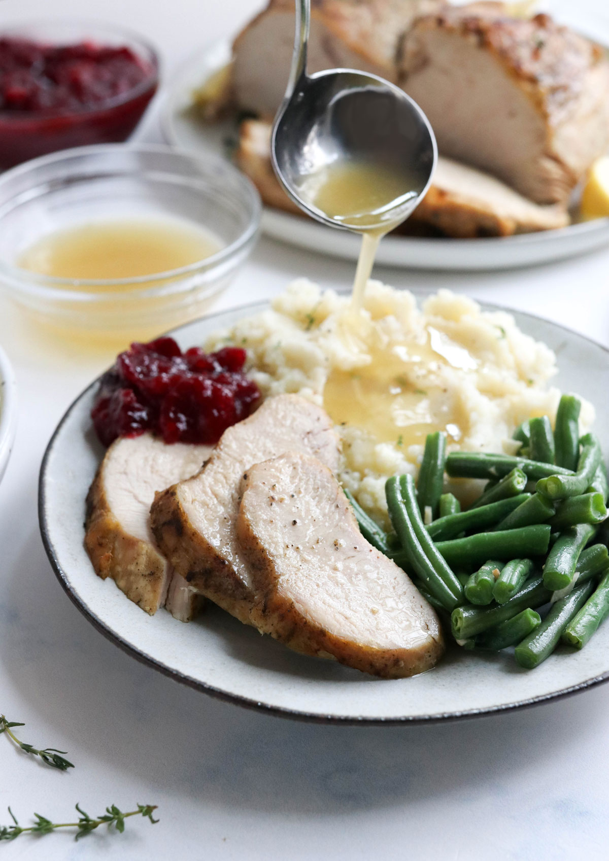 gravy poured over mashed potatoes and turkey