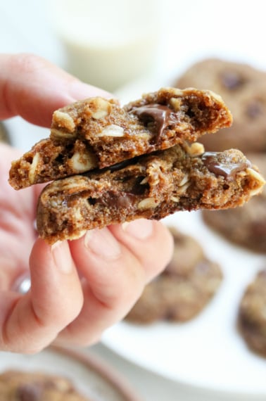 hand holding a lactation cookie split in half.