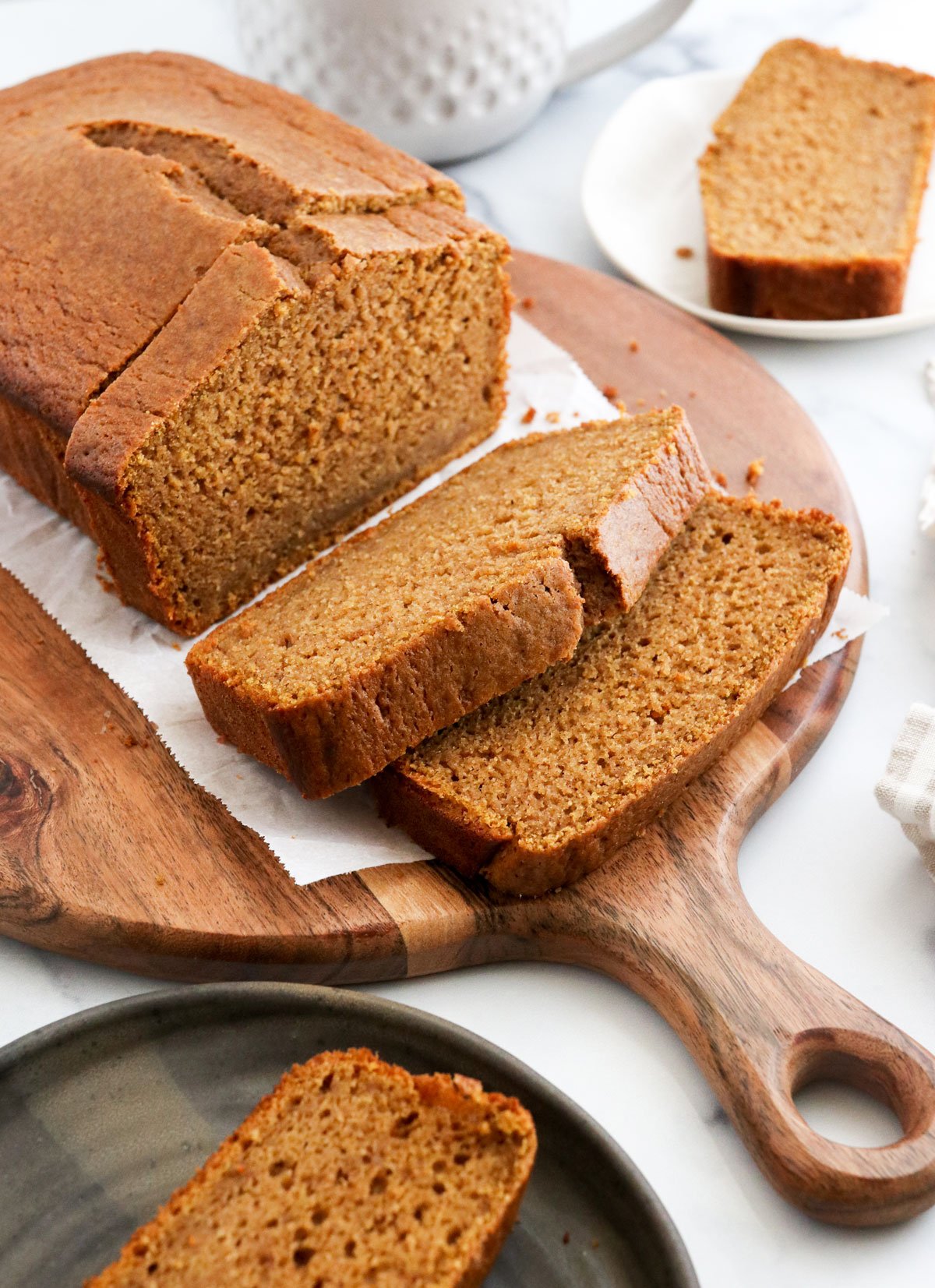 oat flour pumpkin bread sliced on board