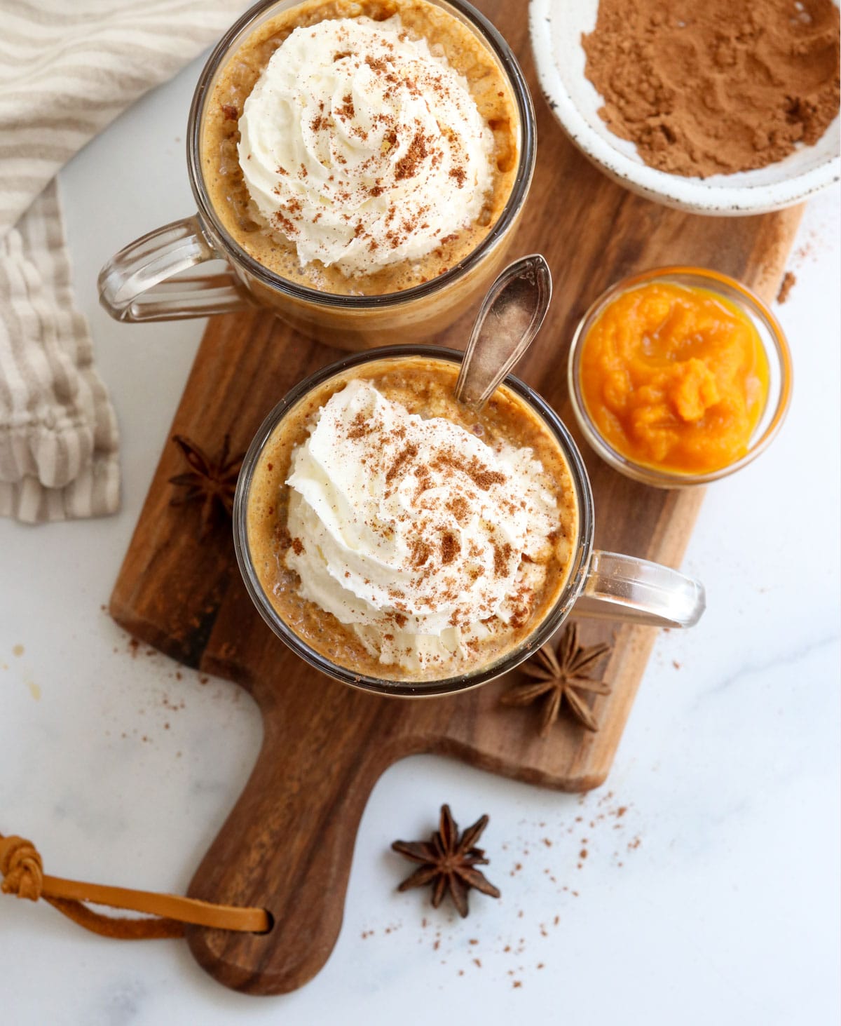 pumpkin spiced lattes overhead on a cutting board