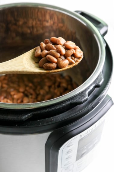 spoon full of beans over the Instant Pot