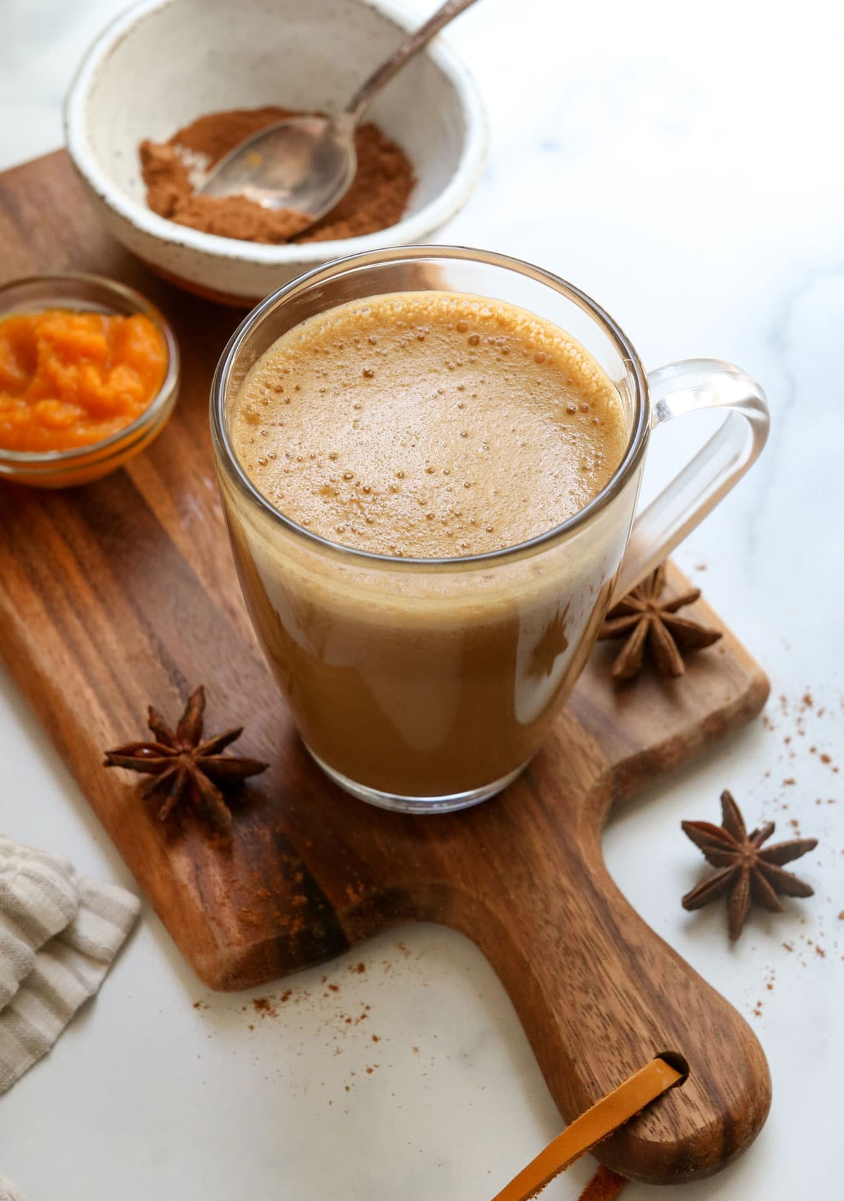 pumpkin spice latte with foam on top at an angle