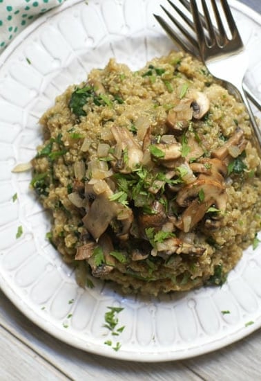 mushroom spinach quinoa risotto on plate with forks