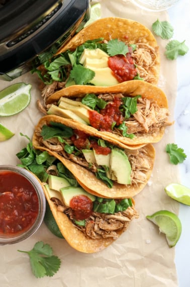 slow cooker chicken tacos stacked together