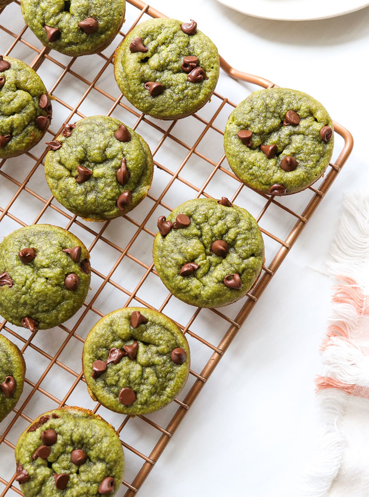 spinach muffins on cooling rack.