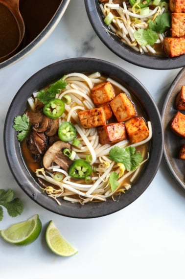 vegan pho in black bowls