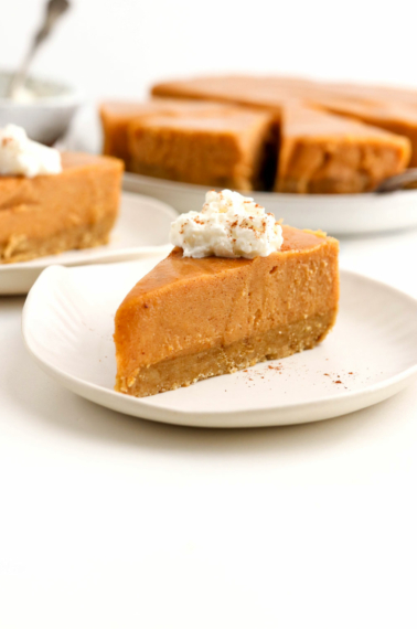 slice of vegan pumpkin cheesecake on plate