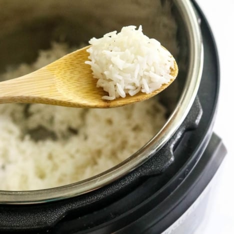 white rice on spoon over Instant Pot